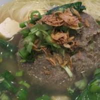 Pregnant Meat Ball · Big meatball filled with small meatballs and quail eggs in soup served with egg noodle, verm...