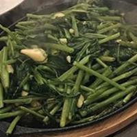 Water Spinach Hot Plate · Sauteed water spinach with garlic and sesame oil served in a hot plate.