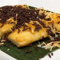 Grilled Fermented Cassava · Grilled fermented cassava, cheese, chocolate, and condensed milk.
