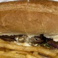 Philly Cheesesteak · Philly Steak Grilled with Onion, Green Pepper & Mushroom  Topped with Cheese .