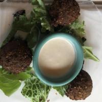 Falafel · Ground chickpeas, fava beans, parsley and cilantro blended with spices. Served with vermicel...