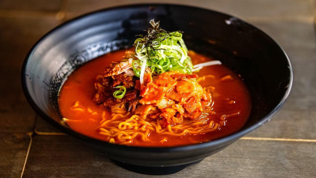 Kimchi Ramen · Korean-style craft ramen made with kimchi bacon broth, braised pork, stewed bacon kimchi, scallions, and nori.