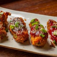 Korean Fried Chicken · Crispy buttermilk marinated chicken wings. Served in sauce of choice.