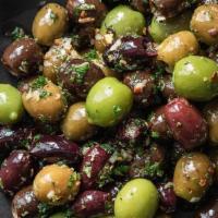 Marinated Mixed Olives · Marinated with rosemary, lemon zest, and chili flakes.