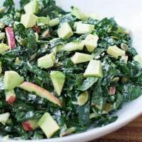 Organic Kale Caesar Salad · Avocado, apples, seasoned croutons, shaved Parmesan cheese, and homemade Caesar dressing.