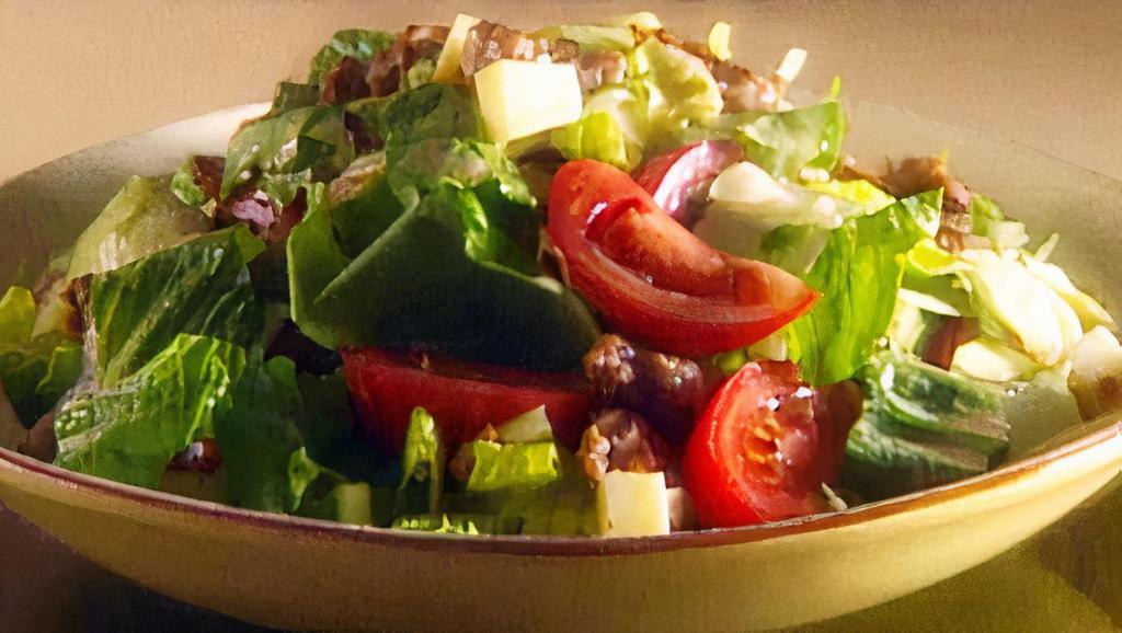 House Salad · Mixed greens, tomatoes, cucumbers, carrots, and maple balsamic vinaigrette.