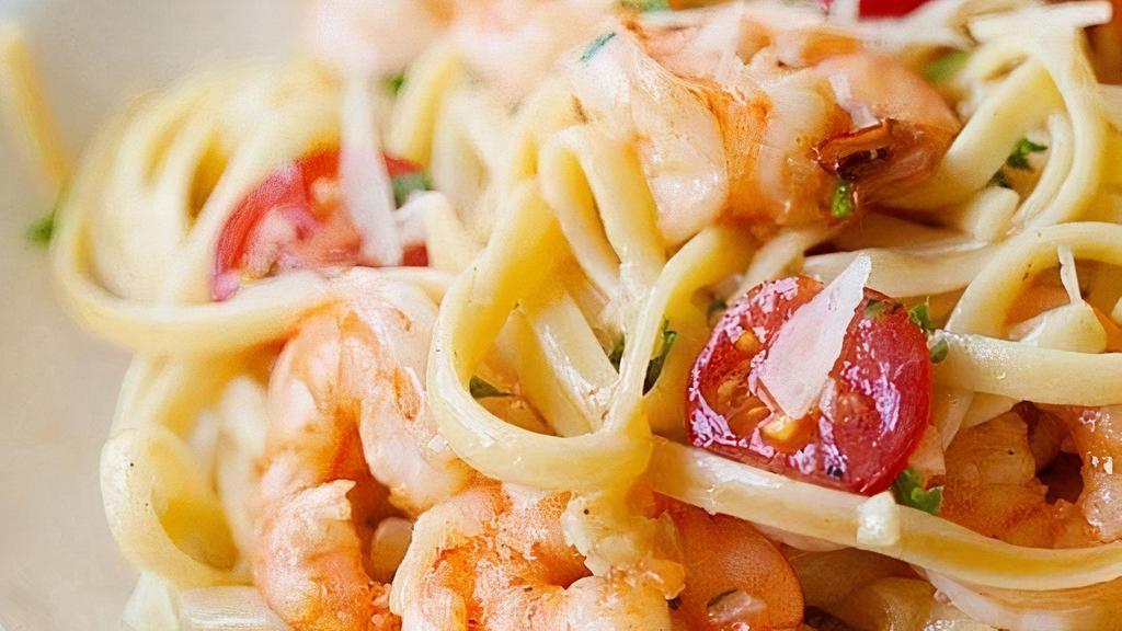 Linguini Shrimp Scampi · Marinated wild gulf shrimps, parsley, thyme, garlic, butter, white wine lemon sauce, and 5 months aged Parmesan cheese. Served with fresh bread, choice of optional protein and vegetable add ons.