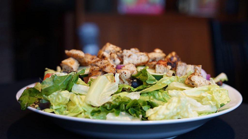 Grilled Chicken Salad · Mixed greens, grilled chicken, tomatoes, cucumbers and onions.