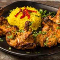 Chicken Chop · Marinated in five spices. Served with yellow lemon rice.
