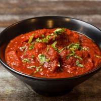 Lamb Vindaloo · Spicy. Vinegar infused red chili paste and ginger.