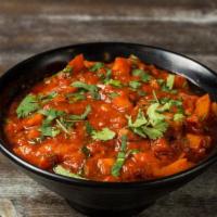 Rogan Josh · Lamb curry, fresh tomatoes, and saffron.