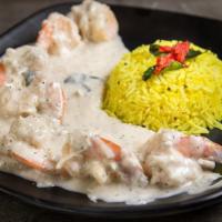 Coconut Shrimp · Shrimp pan roasted with coconut lemon sauce. Served with yellow lemon rice.