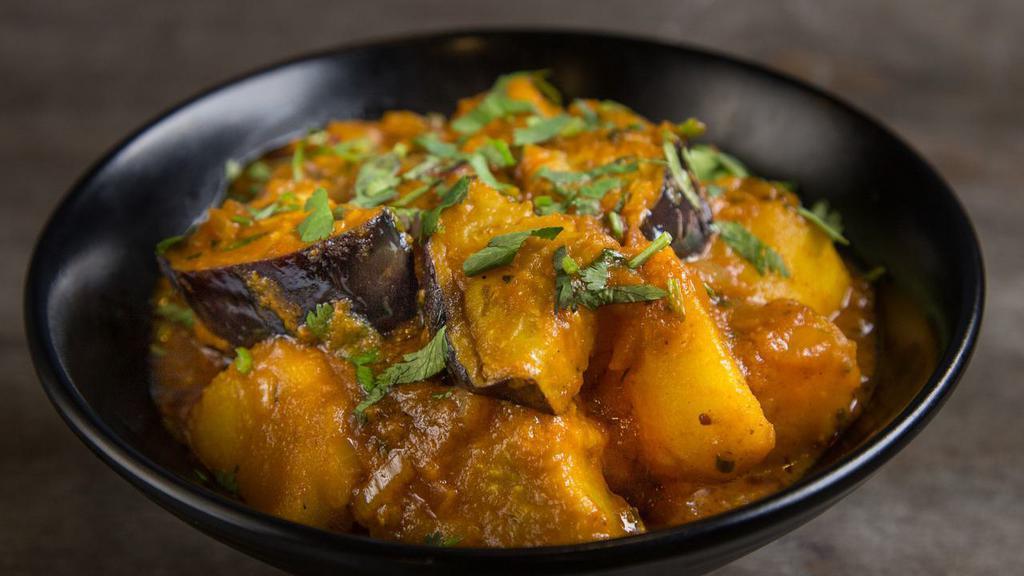 Achari Aloo Baigan · Spicy. Spiced pickled potatoes and eggplant.