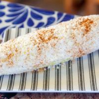 Elote · Traditional mexican corn on the cob with mayo lime chile powder and cojita cheese.