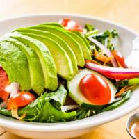 Ensalada Del Puerto · Greens, avocado, watercress, red onions, tomatoes, red peppers, and shredded carrots with ou...