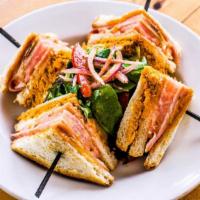 Completo · Dominican club sandwich layered with shredded chicken, tomato, ham, muenster cheese, and ket...
