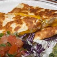 Quesadilla · Flour tortillas, sautéed poblano peppers, red onion, roasted corn, cheese, guacamole, pico d...