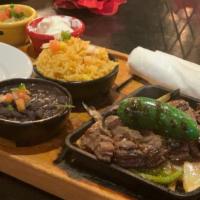 Steak Fajitas · Served with mexican rice black beans pico de gallo sour cream and flour tortillas. choice of...