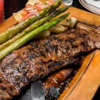 Arracheras · Grilled skirt steak, asparagus, yuca frita, citrus red cabbage.
Extra sides at additional co...