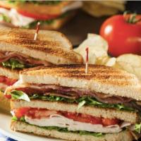 Turkey Club · Oven roasted turkey, crispy bacon, American cheese, lettuce, tomato, mayo.