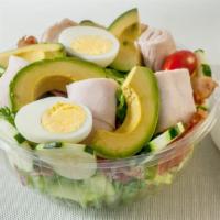 Cobb Salad · Roasted turkey, crisp bacon, cucumbers, tomato, hard-boiled egg, sliced red onion, Haas avoc...