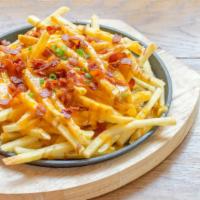 Bacon Cheese Fries · Crispy bacon and cheese topped on crispy fries.