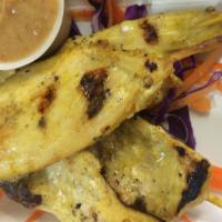 Chicken Satay · Four skewered chicken strips marinated in thai coconut sauce and served with peanut sauce.