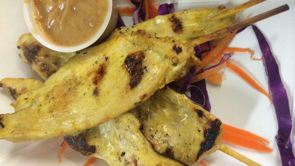 Chicken Satay · Four skewered chicken strips marinated in thai coconut sauce and served with peanut sauce.