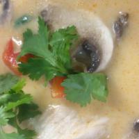 Tom Kha Soup · Gluten free. Classic thai soup with coconut milk, chicken, mushroom, bell pepper and cilantro.