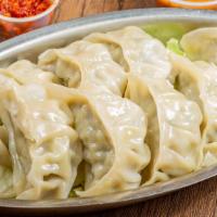 Steamed Momo · Steamed dumpling with minced chicken or paneer cottage cheese filling in an unflavored wrap ...