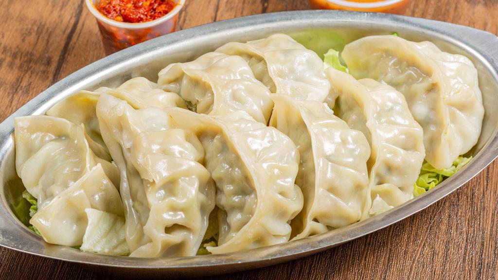 Steamed Momo · Steamed dumpling with minced chicken or paneer cottage cheese filling in an unflavored wrap to give you the original taste of Nepal. Served with tomato chutney sauce.