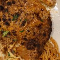 Chicken Parmigiano · Chicken breaded topped with mozzarella served with spaghetti tomato sauce.
