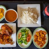 Combo 1 · One whole chicken with white rice, beans, salad or fried green plantains or sweet plaintains...