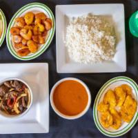 Combo 7 · stew beef/ Rez Guisado with white rice, beans sweet plantains or salad or fried green planta...