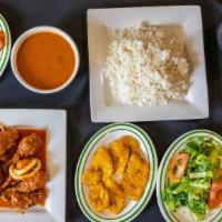 Combo 3 · Chicken stew/ pollo guisado  with white rice, beans, salad or fried green plantains, and a t...