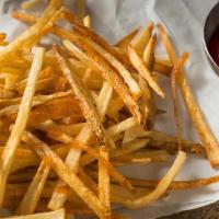 French Fries · Golden and crispy, shoestring French fries, served with ketchup on the side.
