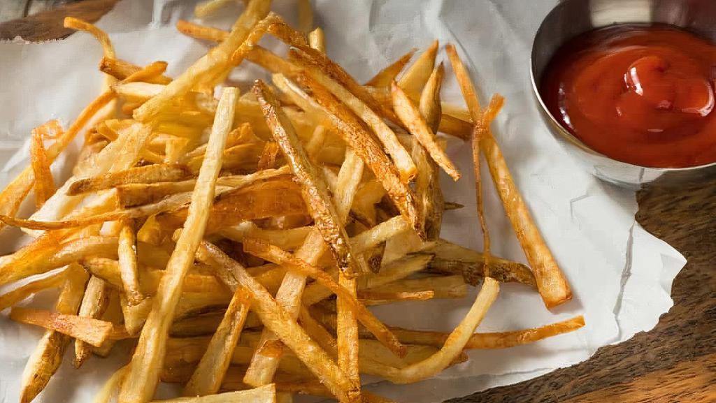 French Fries · Golden and crispy, shoestring French fries, served with ketchup on the side.