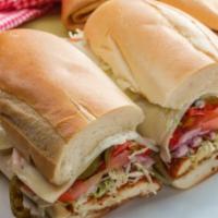 The Bird Sandwich · Delicious sandwich made with chicken cutlet, lettuce, tomatoes, mozzarella cheese, and a Rus...