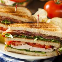 Turkey Club Sandwich · Delicious sandwich made with slices of turkey, bacon, lettuce, tomatoes, and mayo on your ch...