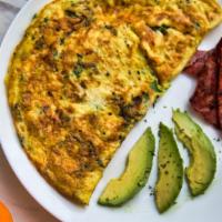 Monterey Omelette Platter · Fresh omelette prepared with scrambled eggs, bacon, avocado, salsa and cheddar cheese. Serve...