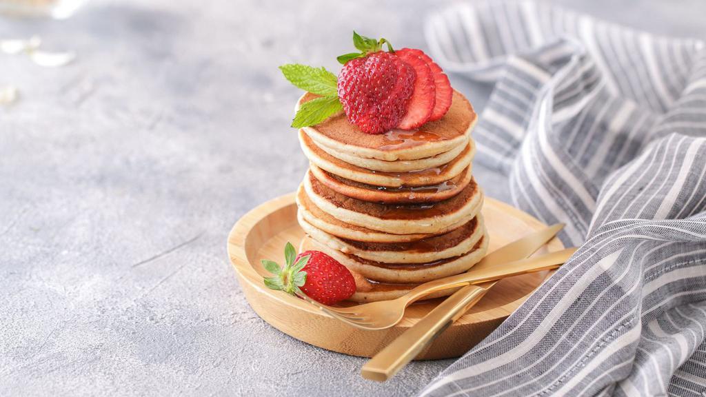 Buttermilk Pancakes With Strawberries · 3 pieces of freshly prepared Pancakes. Topped with fresh strawberry slices.