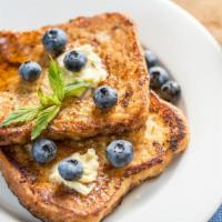 French Toast With Blueberries · 3 pieces of freshly cooked French Toast. Topped with Fresh Blueberries.