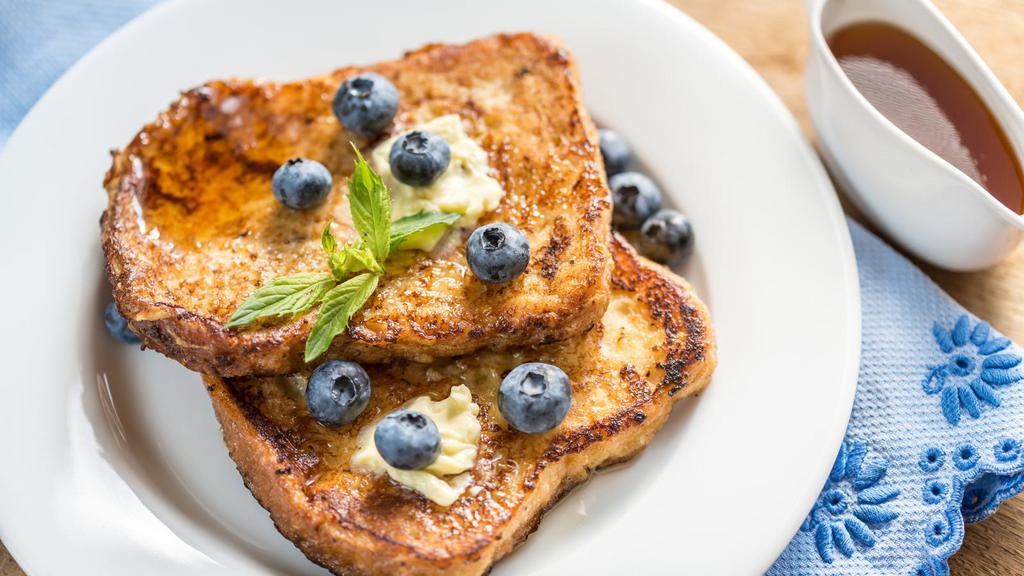French Toast With Blueberries · 3 pieces of freshly cooked French Toast. Topped with Fresh Blueberries.