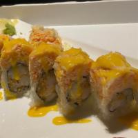 American Dream · Rock shrimp tempura inside, topped with kani, served with spicy mango sauce.
