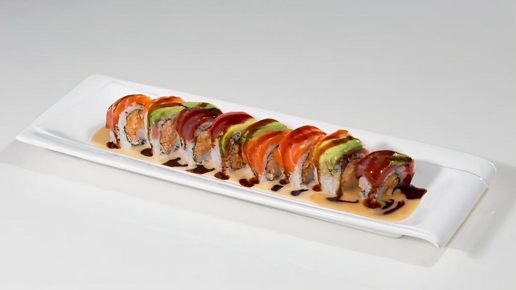 *Lobster Rainbow · Spicy crunchy lobster and kani inside, topped with tuna, salmon, and avocado, yuzu miso, and eel sauce.