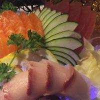 *Tricolor Sashimi · Six pieces of tuna, six pieces of salmon, and six pieces yellowtail.