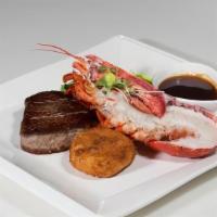 Surf & Turf · Grilled beef tenderloin and lobster tail, crispy mashed potato, au jus port wine reduction.