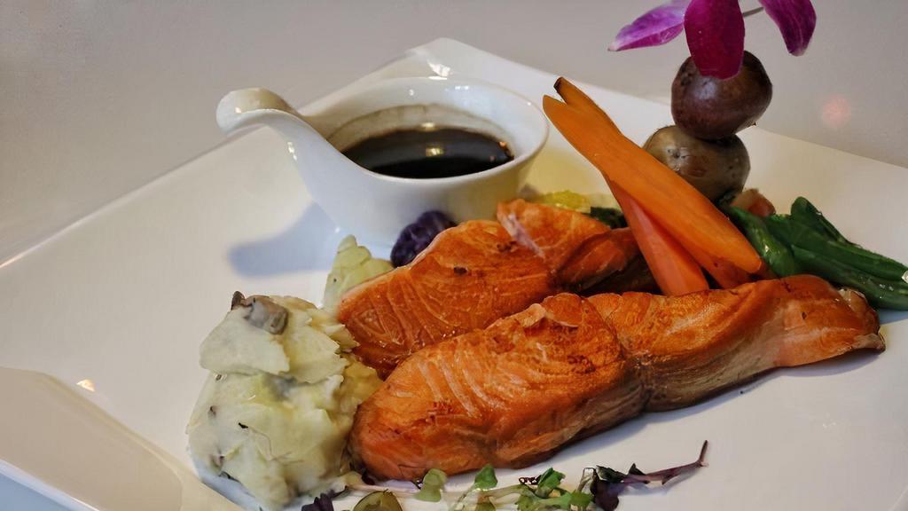 Scottish Salmon · Slow-cooked fresh salmon, with seasonal vegetable, and truffle sauce.
