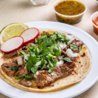 Steak Tacos · Our Tacos are served on fresh soft corn tortilla, finished with freshly cut white onions and...