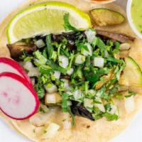 Veggies Tacos · Topped with pico de gallo, avocado and cebolla curtida choice of green, red or guacamole sau...